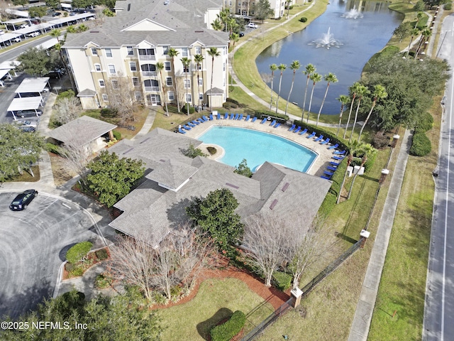 birds eye view of property with a water view