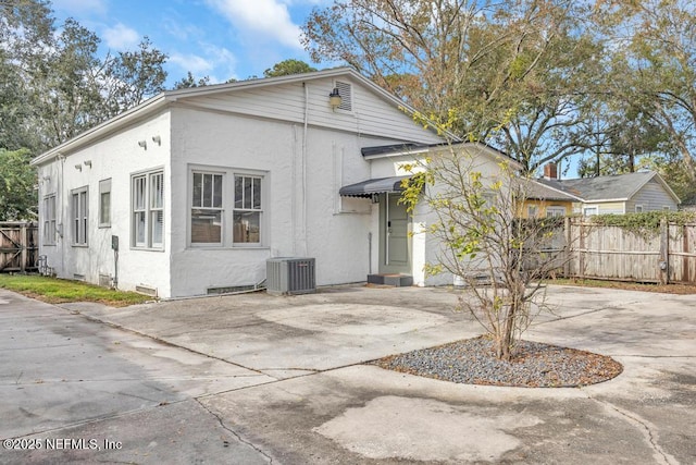 exterior space featuring a patio and central AC