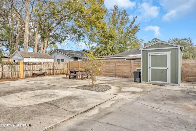 view of patio / terrace featuring a shed