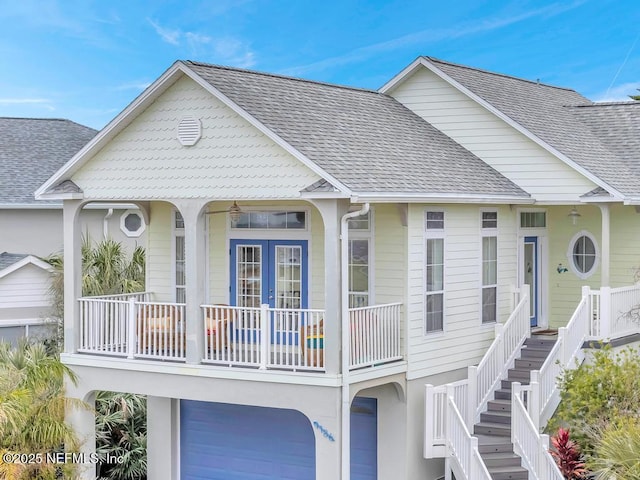 view of front of home featuring french doors and a garage