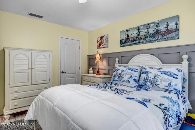 bedroom with wood-type flooring