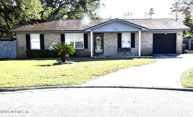 single story home featuring a front yard and a garage