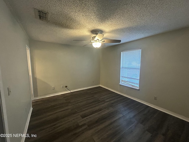 unfurnished room featuring ceiling fan, a textured ceiling, and dark hardwood / wood-style flooring