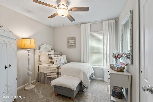 bedroom featuring ceiling fan and light carpet