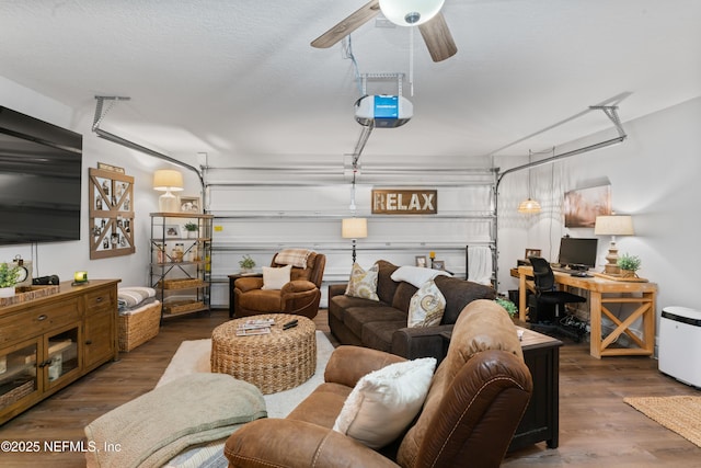 garage featuring ceiling fan and a garage door opener