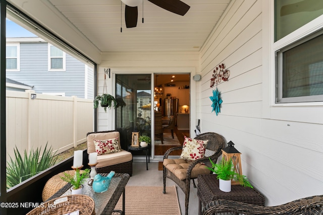 sunroom with ceiling fan