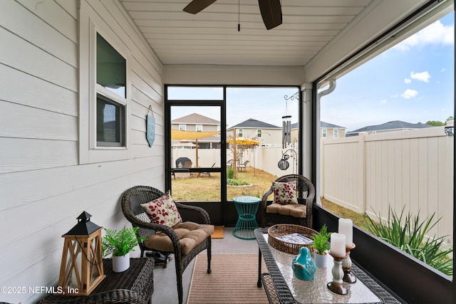 sunroom / solarium with ceiling fan