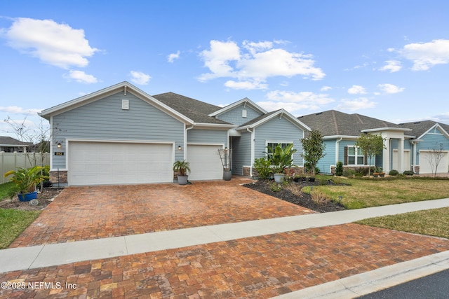 ranch-style house with a front yard and a garage