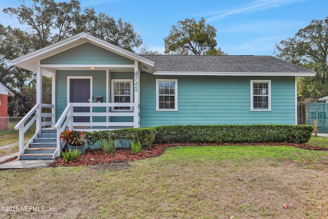 view of front of home featuring a front lawn and a porch