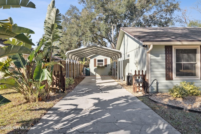 view of side of home with a carport