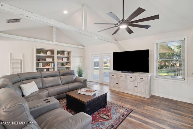 living room featuring ceiling fan, vaulted ceiling with beams, dark hardwood / wood-style flooring, and french doors