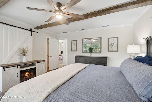 bedroom featuring beam ceiling, crown molding, a barn door, and ceiling fan