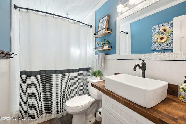 bathroom featuring hardwood / wood-style flooring, vanity, and toilet