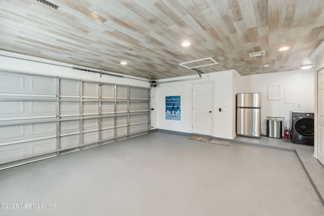 garage with stainless steel refrigerator, wood ceiling, and washer / clothes dryer