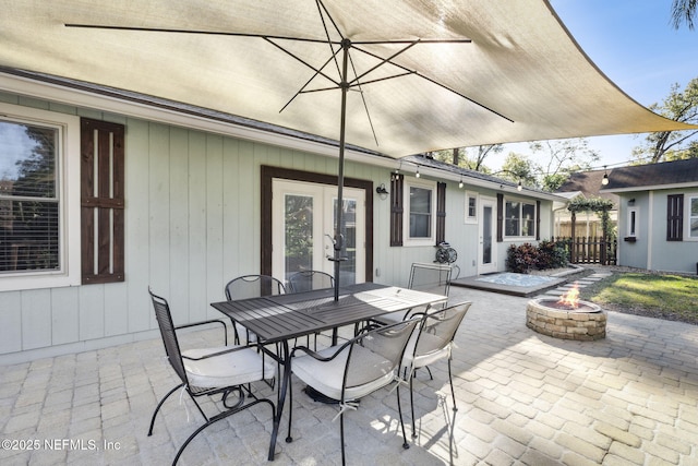 view of patio / terrace featuring an outdoor fire pit