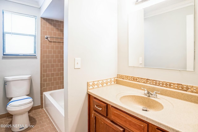 full bathroom featuring crown molding, vanity, toilet, and tile patterned flooring