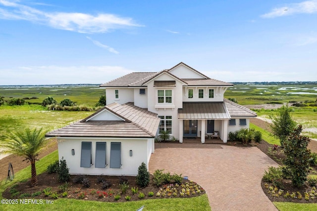 view of front of house with a rural view