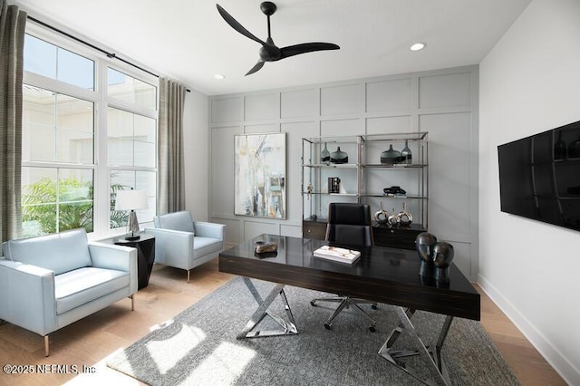 office area with ceiling fan and light wood-type flooring