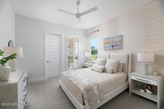 carpeted bedroom featuring ceiling fan and ensuite bathroom