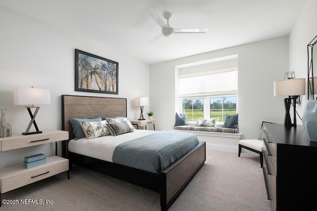 bedroom with ceiling fan and carpet