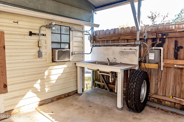 view of patio with sink and cooling unit