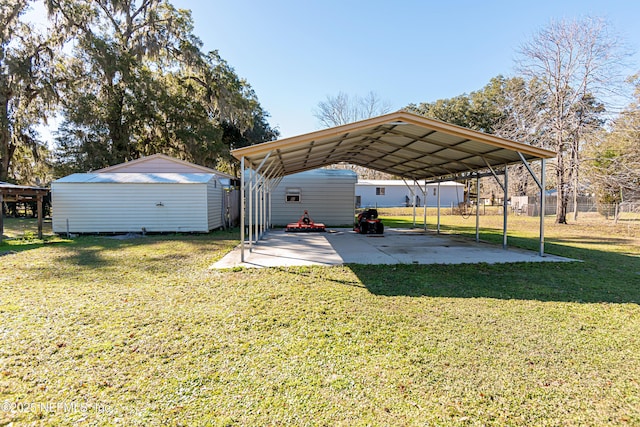 view of yard with a carport and a shed