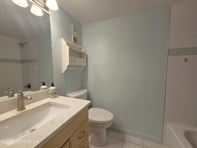 bathroom with vanity, toilet, and tile patterned flooring