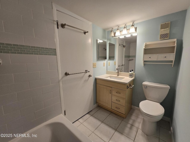 full bathroom featuring tile patterned flooring, toilet, vanity, baseboards, and shower / washtub combination