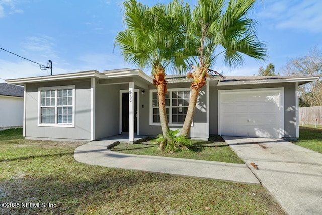 ranch-style home featuring a front lawn and a garage