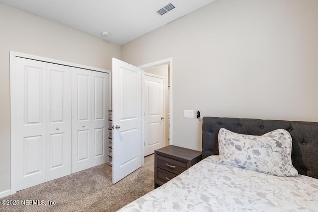 carpeted bedroom with a closet