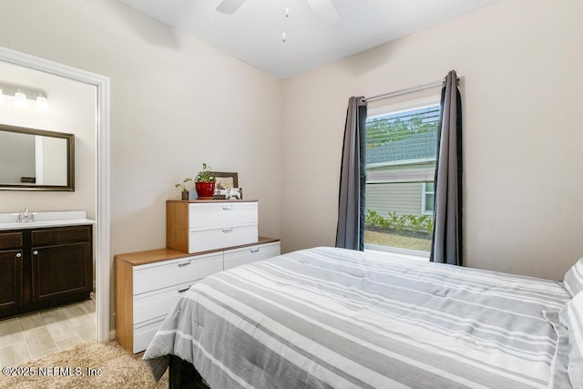 bedroom with light wood-type flooring and ceiling fan