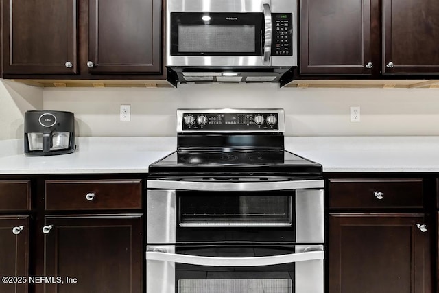 kitchen featuring dark brown cabinets and stainless steel appliances