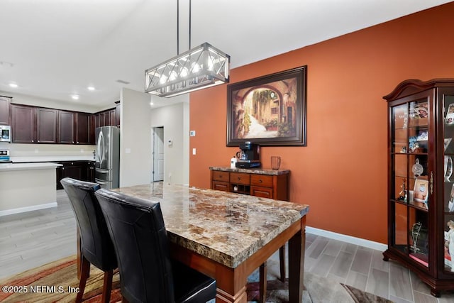 dining area with light hardwood / wood-style flooring