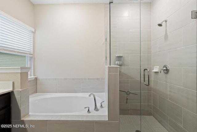 bathroom featuring separate shower and tub and vanity