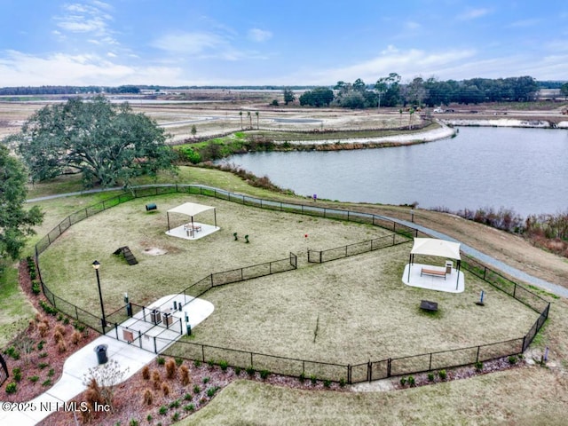 drone / aerial view featuring a water view and a rural view