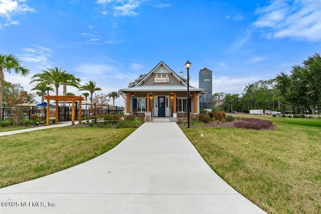 view of front facade featuring covered porch and a front yard