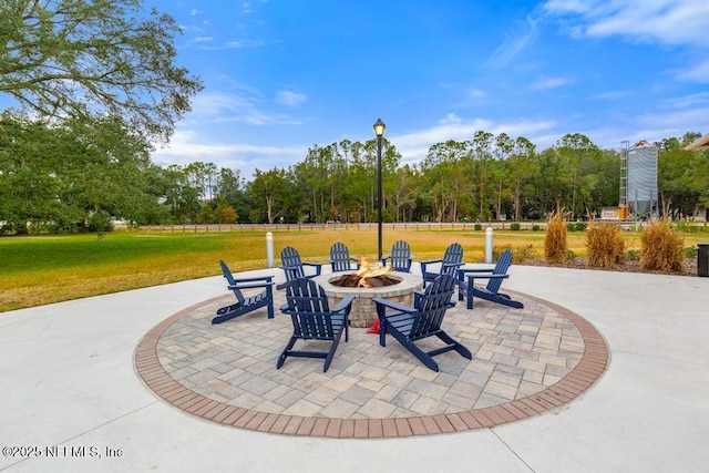 view of patio / terrace with an outdoor fire pit