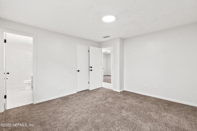 unfurnished room featuring carpet flooring