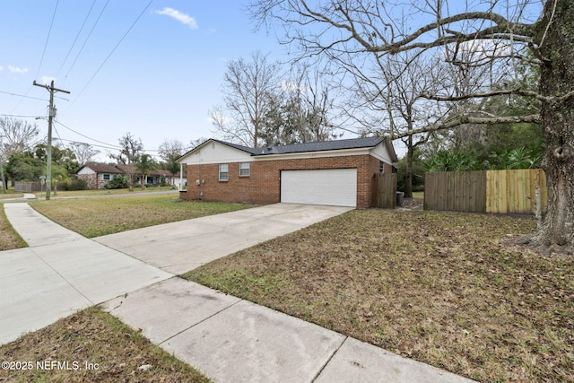 view of front of home with a garage and a front yard