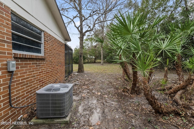 view of yard with central AC