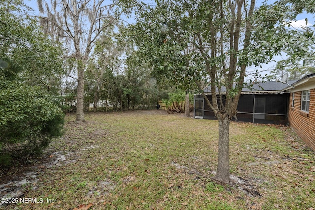 view of yard with a sunroom