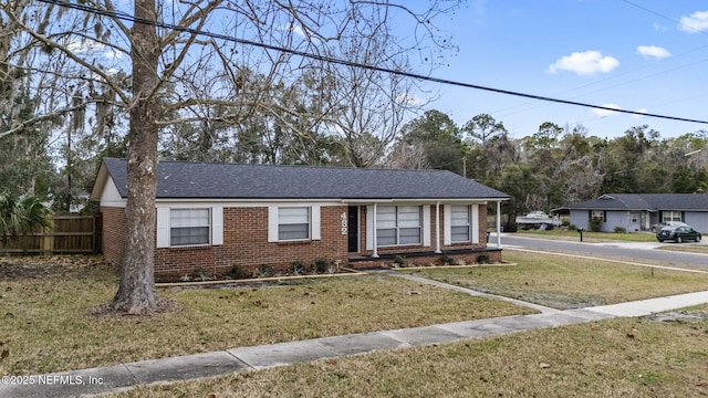 ranch-style house with a front lawn