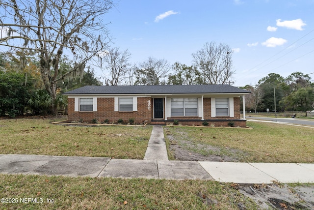 ranch-style house with a front lawn