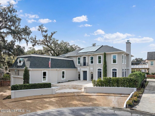 view of front of home featuring solar panels