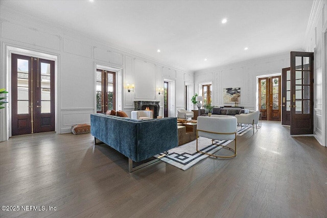 living room with dark hardwood / wood-style floors and french doors