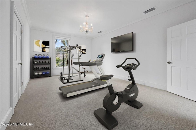 workout room with crown molding, an inviting chandelier, and carpet flooring