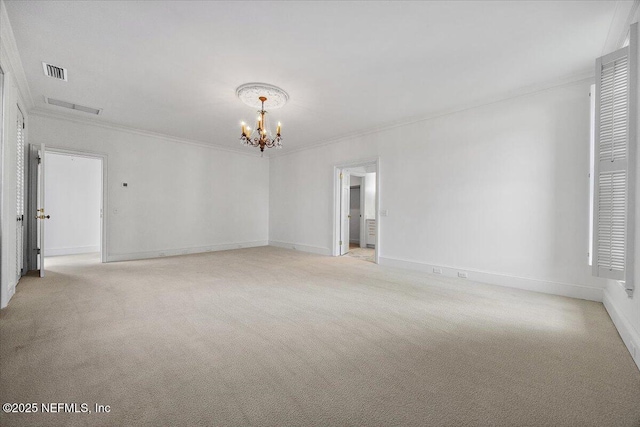 empty room with light carpet, crown molding, and a chandelier