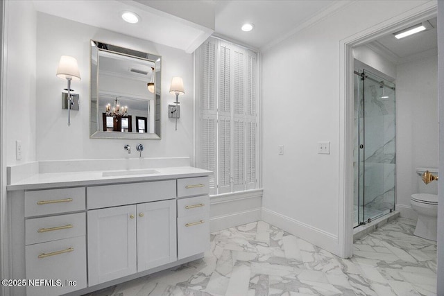 bathroom featuring a shower with door, toilet, vanity, and crown molding