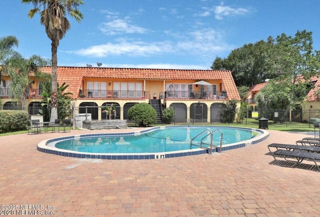 view of swimming pool with a patio area