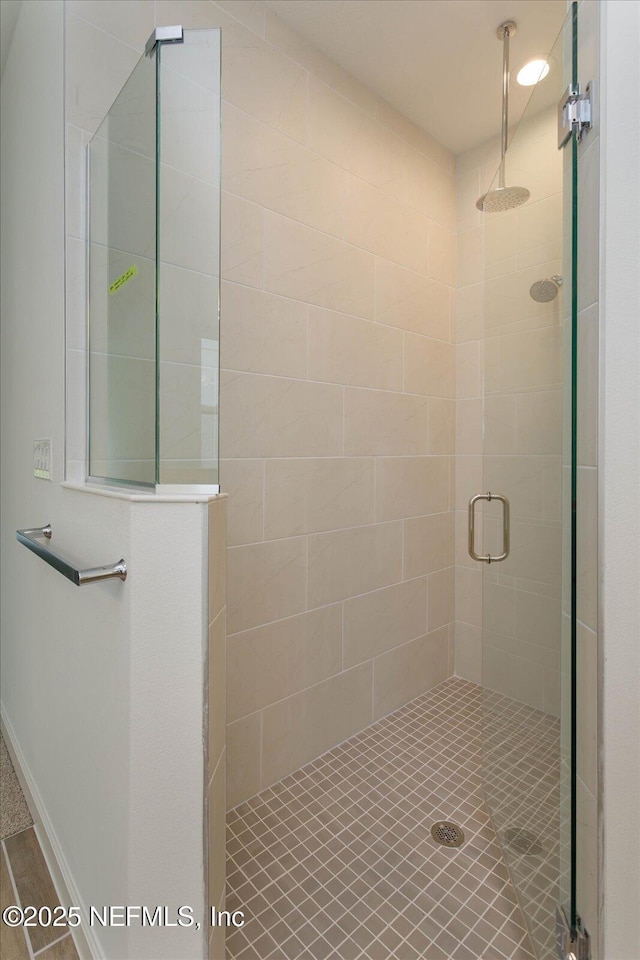 full bathroom with a tile shower